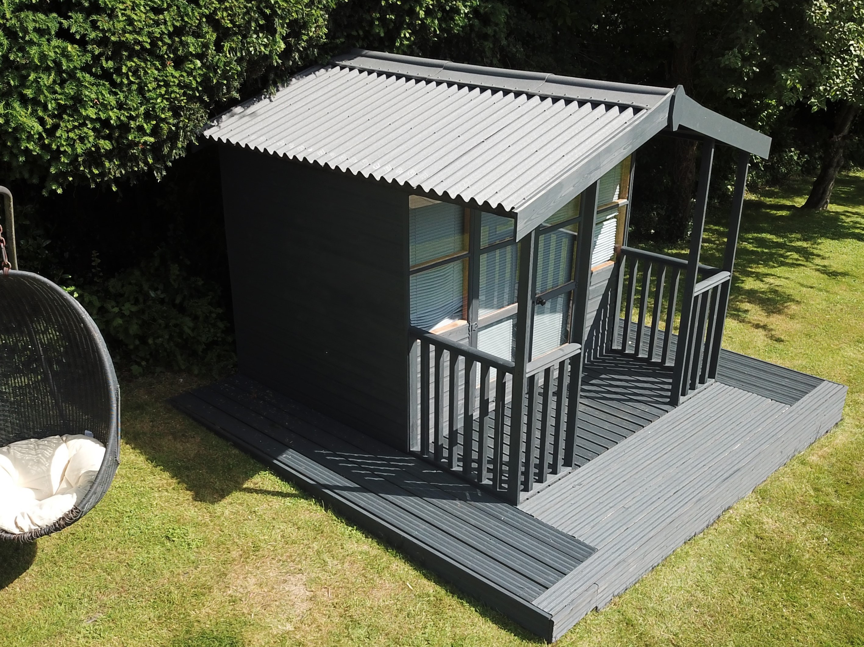 Grey ONDULINE CLASSIC roofing sheets on grey shed/summerhouse