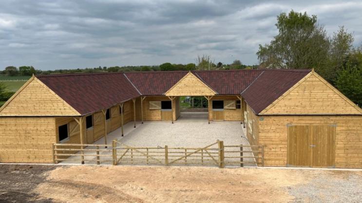 ONDUVILLA shaded red stable block 