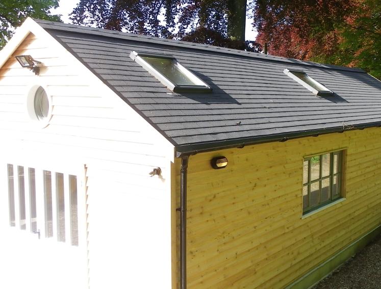 Light timber workshop shed with grey BARDOLINE roof shingles
