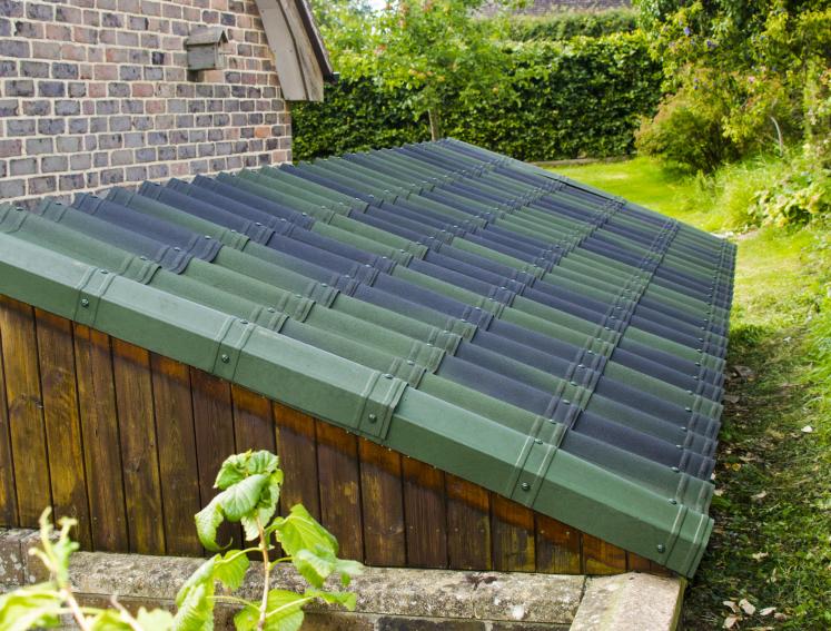 Green ONDUVILLA roofing sheets on lean to shed