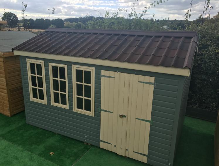 Green and white shed with ONDUVILLA tile look roofing sheets
