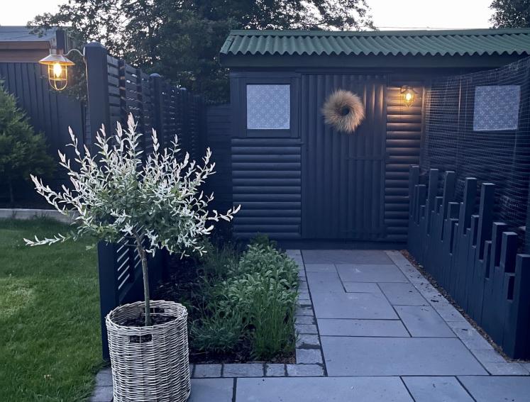 Black shed with green ONDULINE CLASSIC roof sheets