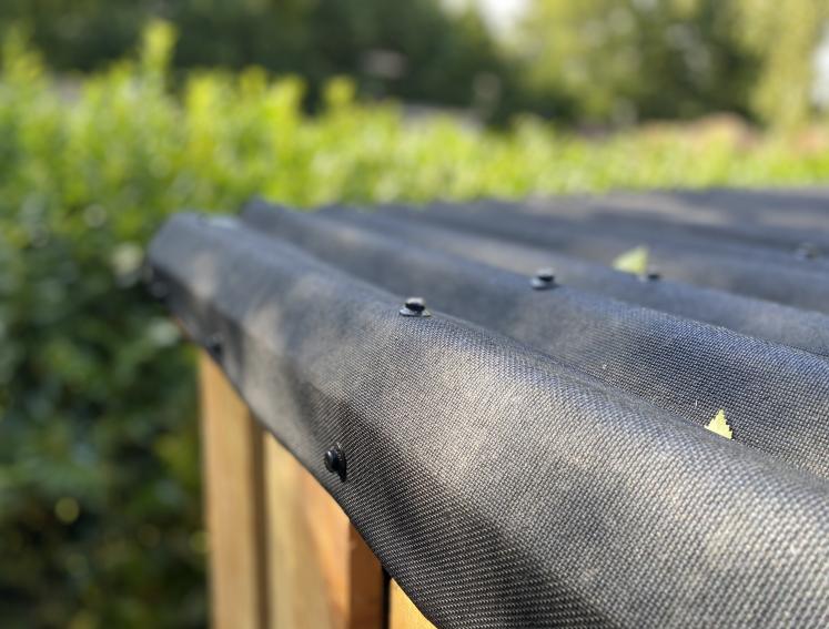 Close up of ONDULINE CLASSIC sheets installed on a shed roof