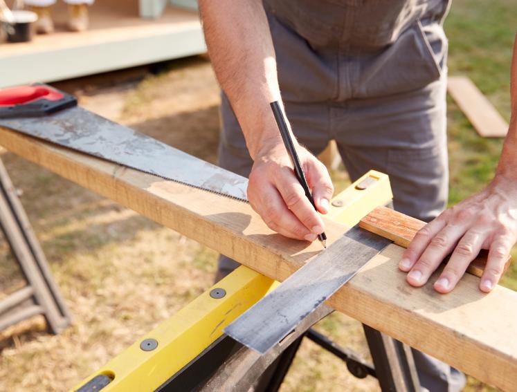 A timber frame being constructed 