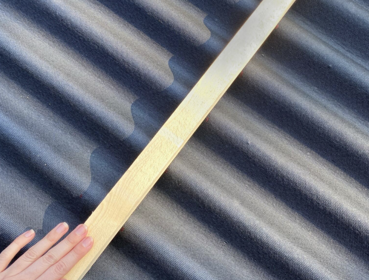 Person cutting Onduline EASYLINE roofing sheets to size