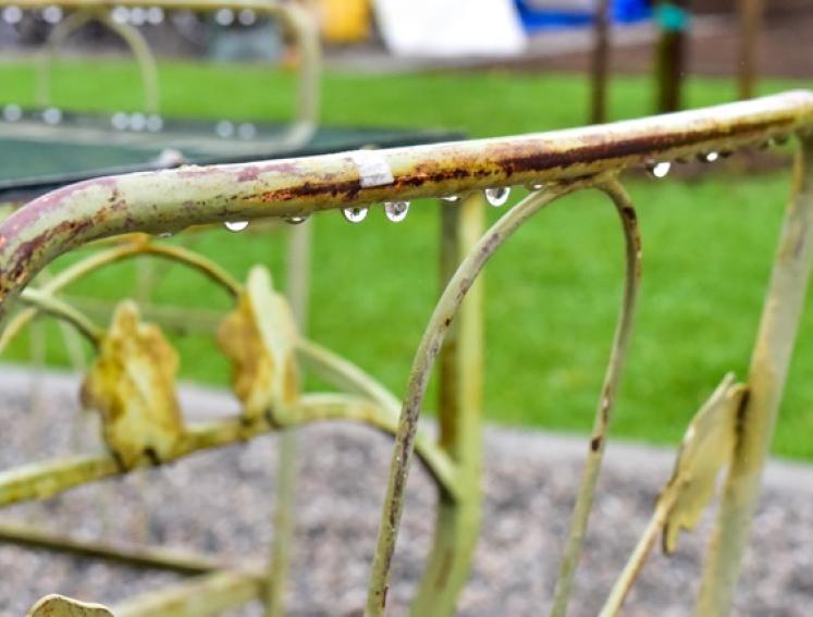 A garden chair in the rain