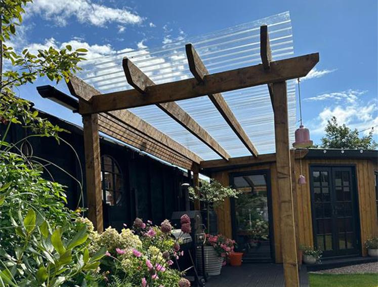 A pergola featuring Onduline polycarbonate roofing sheets