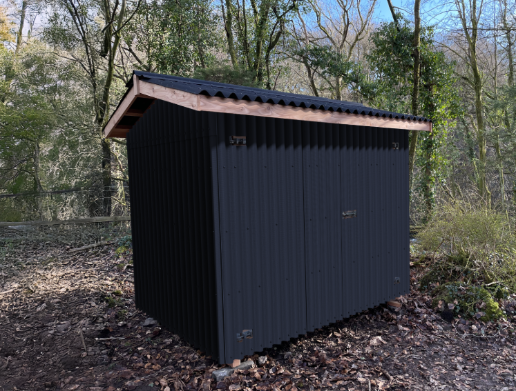 A garden storage unit cladded with ONDULINE CLASSIC sheets