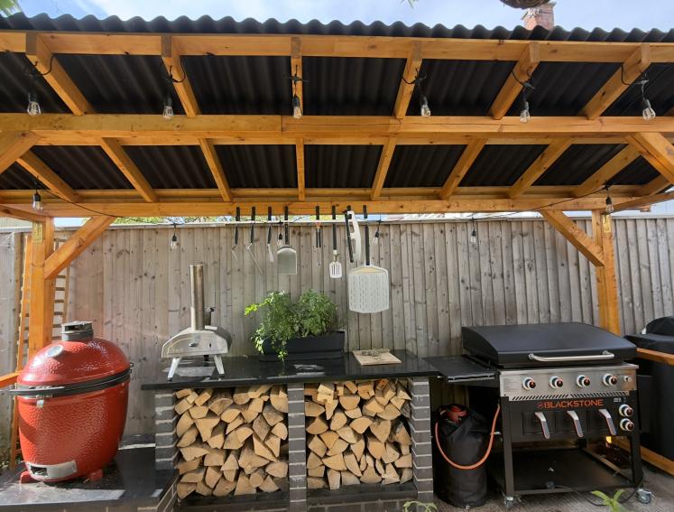 A BBQ station shelter featuring ONDULINE CLASSIC roofing sheets