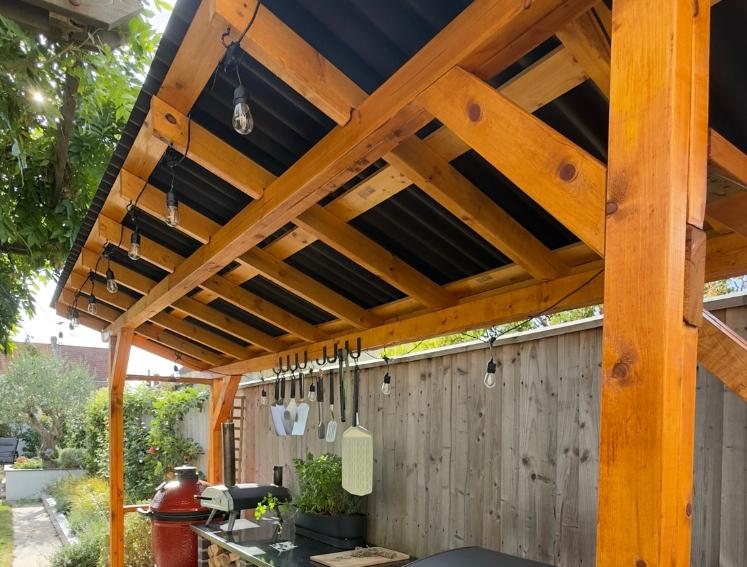 A BBQ station shelter featuring ONDULINE CLASSIC roofing sheets