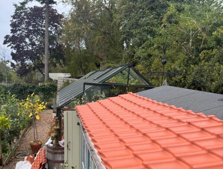 Onduline's INNOLINE roofing sheets being installed on a garden shed
