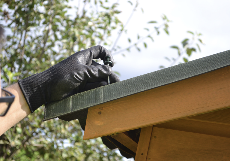 Roofing sheet being installed