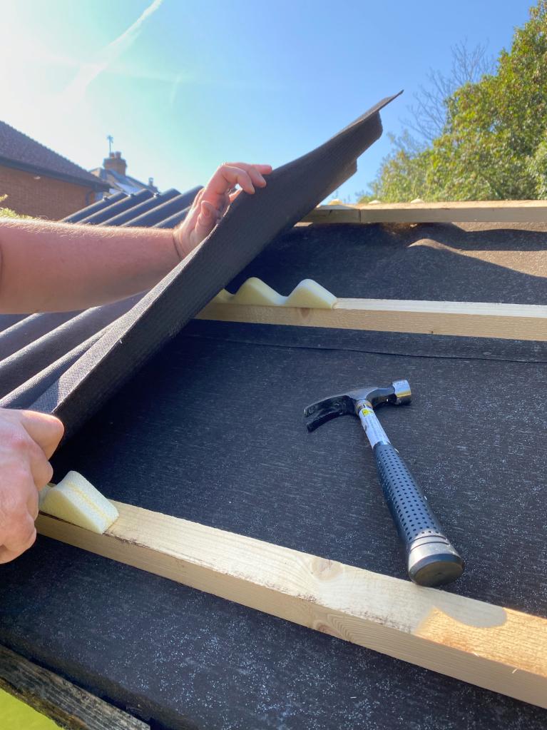 Onduline roofing sheets being installed