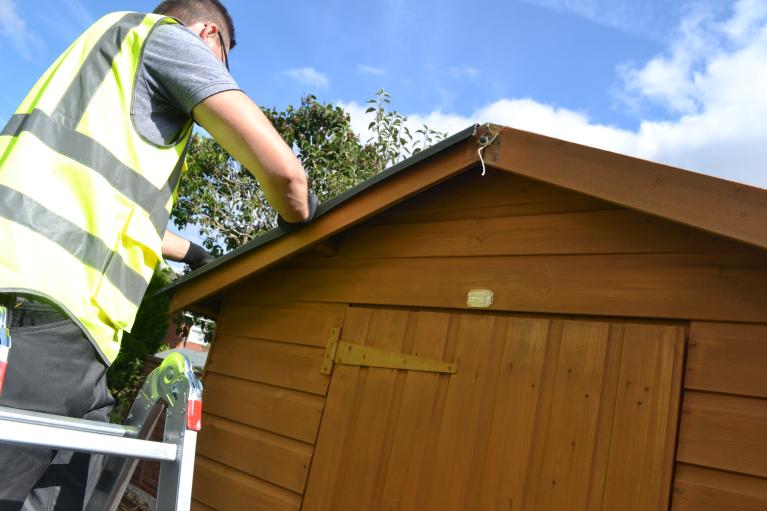 Man carrying out roof maintenance 