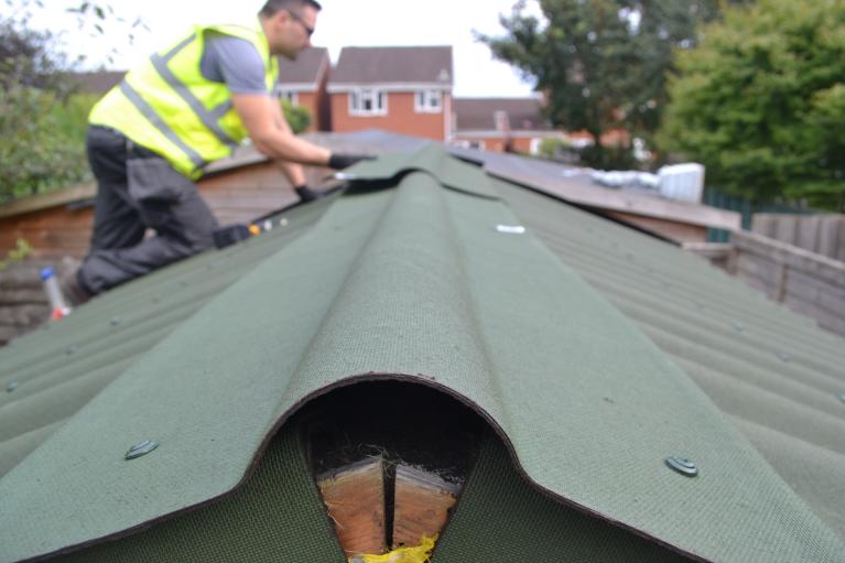 Onduline roofing sheets being installed