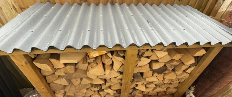 A log store protected by ONDULINE CLASSIC roofing sheets 