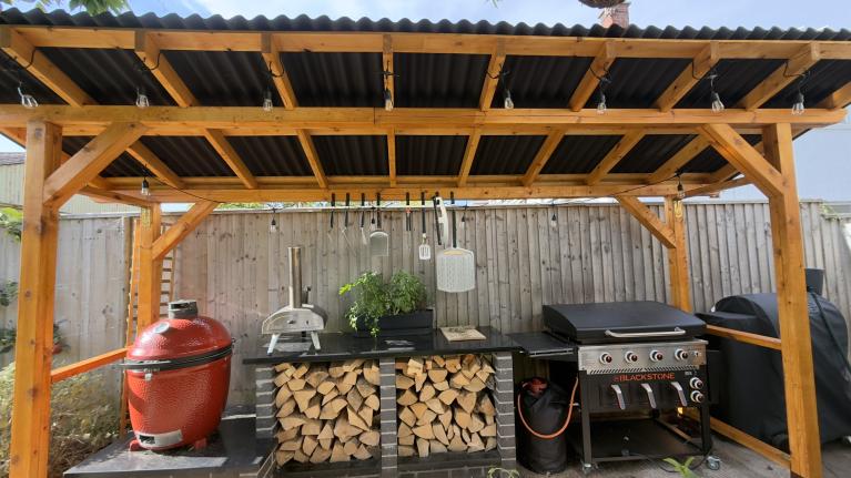 A BBQ station shelter featuring ONDULINE CLASSIC roofing sheets