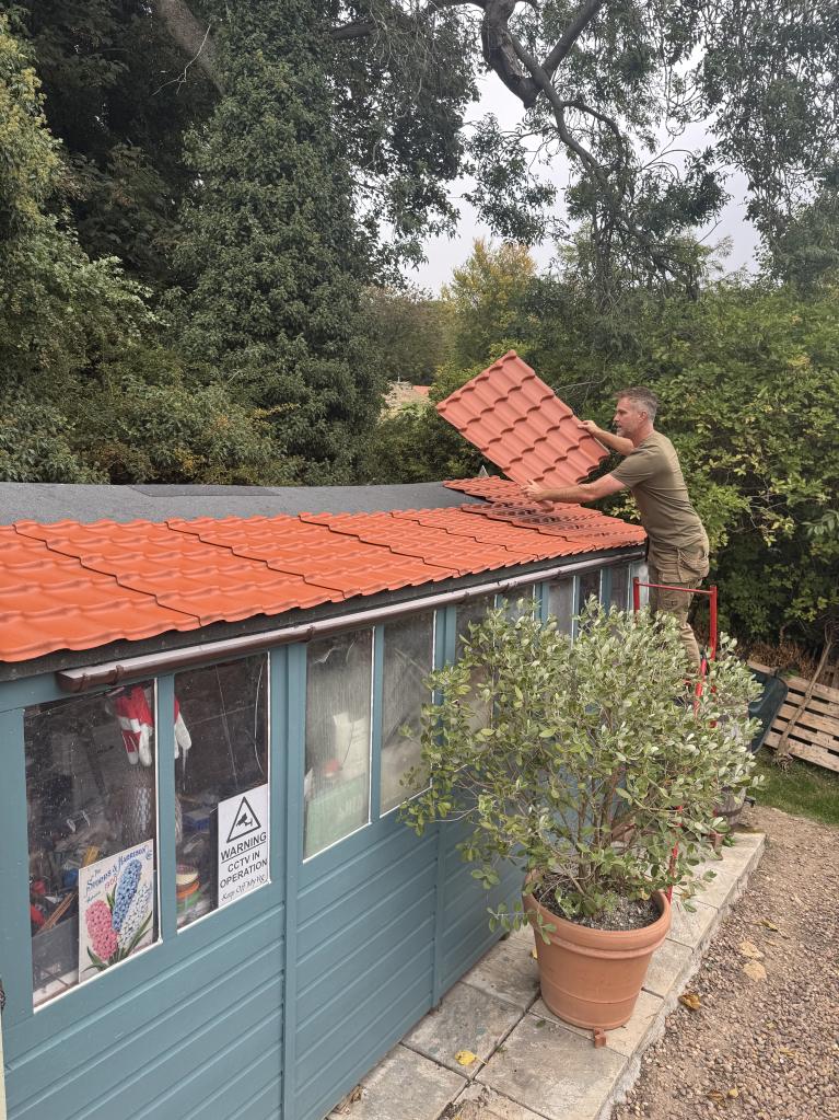 Onduline's INNOLINE roofing sheets being installed on a garden shed
